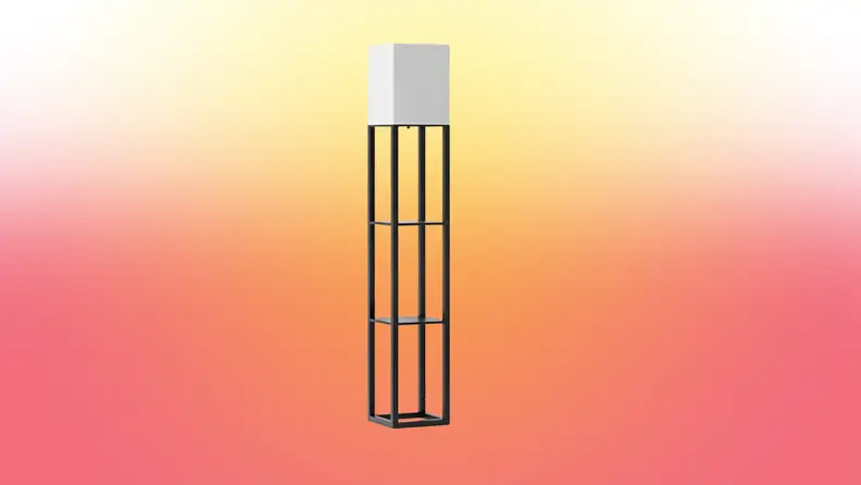 A lamp stands on a red and yellow fade background