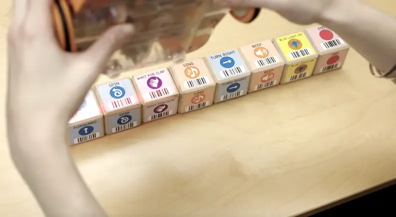 KIBO uses a barcode reader to scan and store commands.