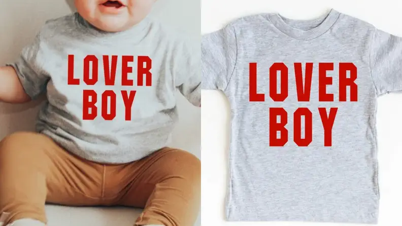 Toddler wearing gray printed t-shirt that reads "Lover Boy"