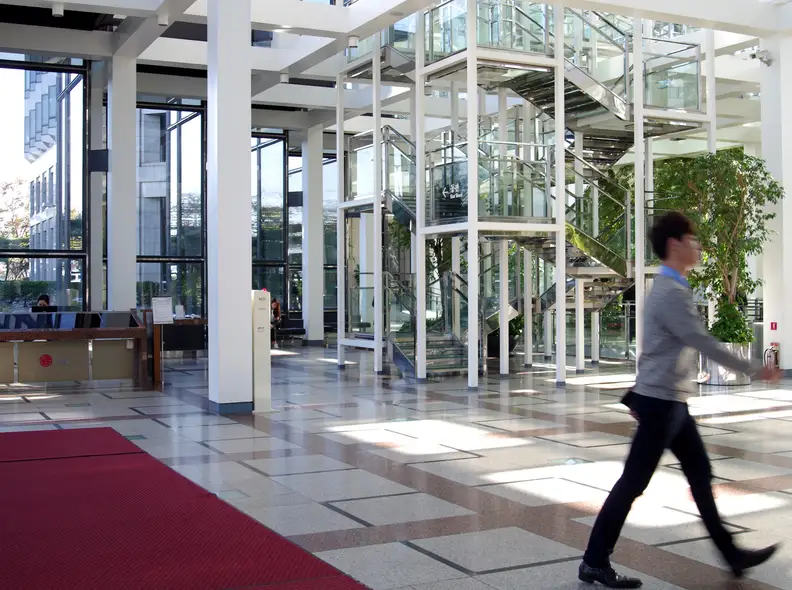 A man walks inside LG Twin Towers Lobby
