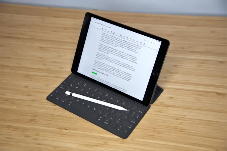 An Apple iPad with a keyboard attached.