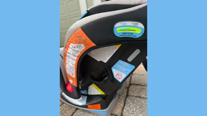 The side of the Graco Extend2Fit 3-In-1 car seat featuring safety procedures.