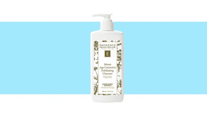 A container of face cleanser against a blue background.