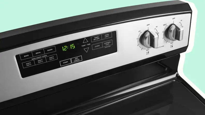 Control panel on an electric stainless steel range and oven.