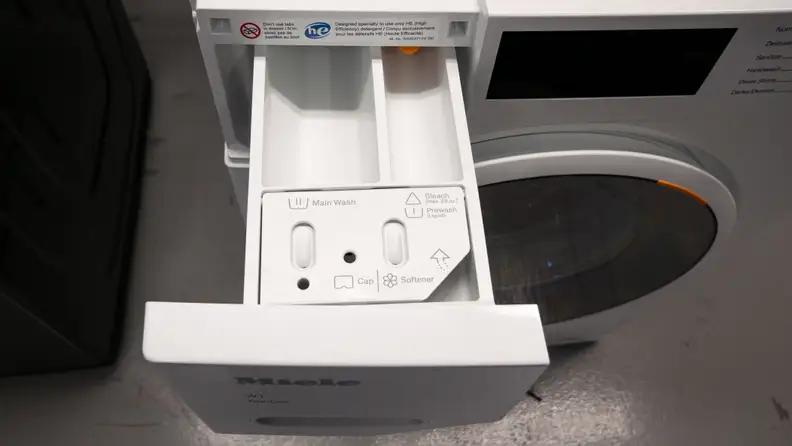 A close-up of the detergent dispenser on the Miele washer.