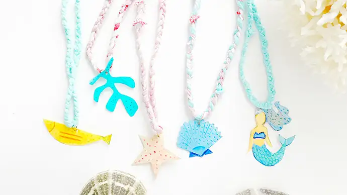 Kids will love crafting their own sea-themed necklaces.