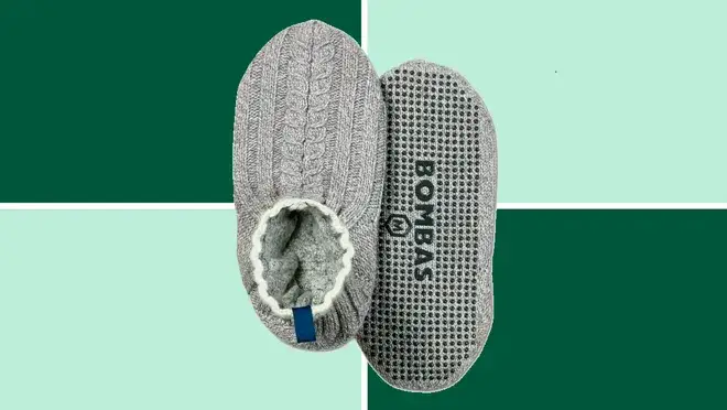 A Bombas Gripper Slippers on a dark and light green background.
