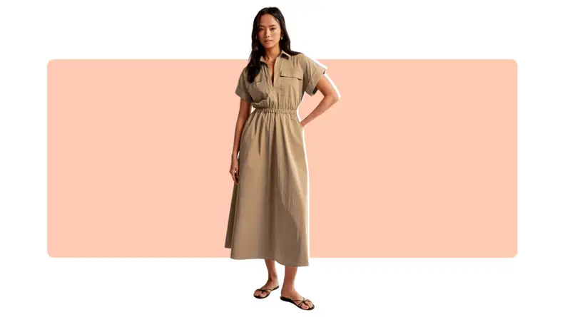 A midi-length shirt dress with an elastic waistband.
