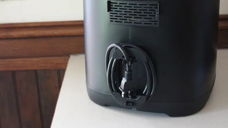 Kalorik 5-Quart Digital Air Fryer's power cord wrapped up and held in place in back of machine.