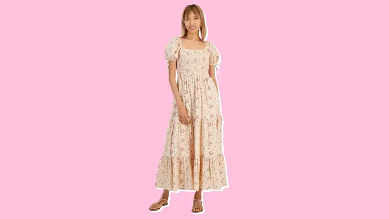 Photo of a woman wearing the And Now This Women's Cotton Scoop-Neck Puff-Sleeve Maxi Dress.