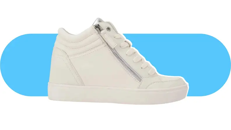 A white leather wedge sneaker with a zipper.