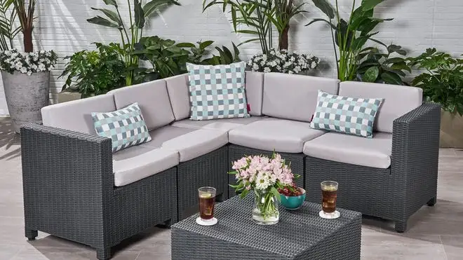 Black patio furniture with light gray cushions