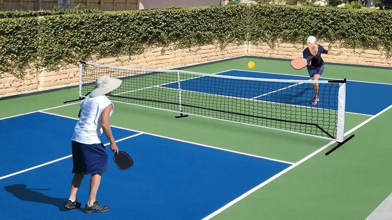 Two people on pickleball court playing a set