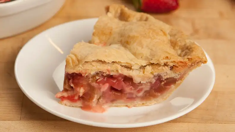 Slice of fruity pie on a white dish