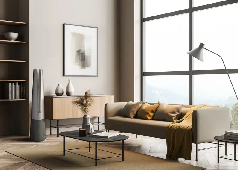 A shot of the beige LG AeroTower air purifier in a modern living room.