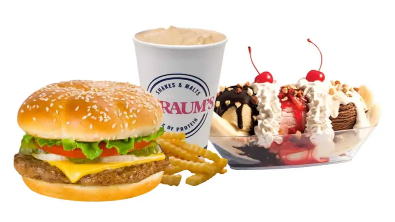 A cheeseburger and fries next to a shake and a banana split