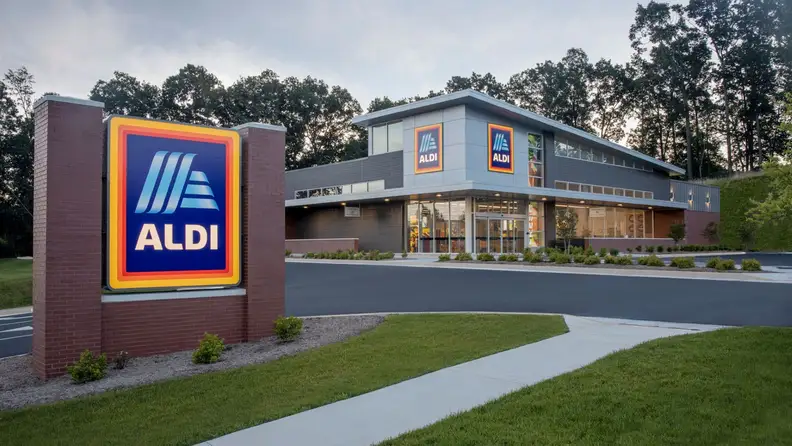 ALDI storefront and sign with a landscaped entrance