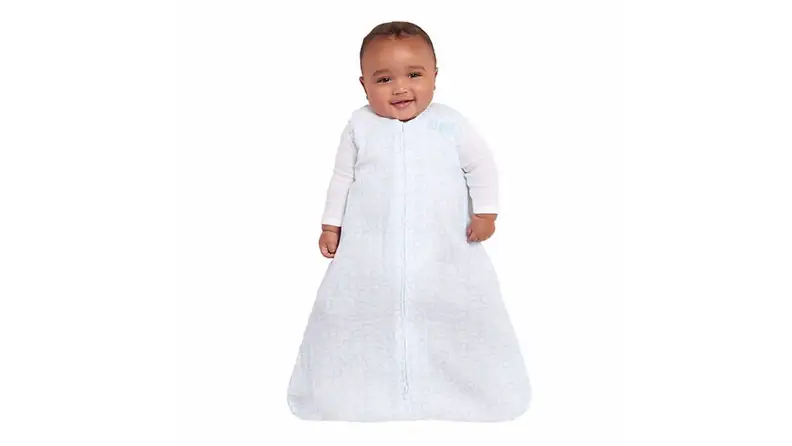 BIPOC infant in a sleep sack with beautiful pale blue print.