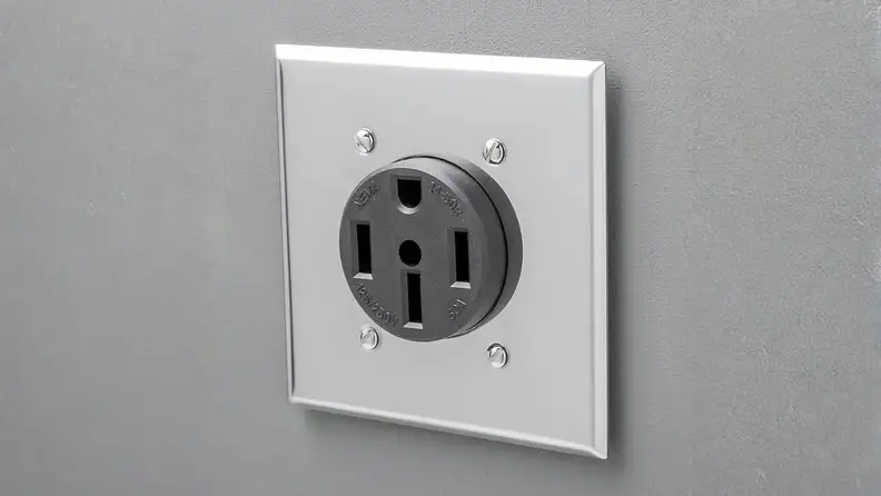 NEMA 14-50 outlet on a gray wall
