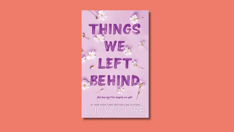 An image of the cover of 'Things We Left Behind' by Lucy Score, featuring the title in dark purple text on a lavender background.