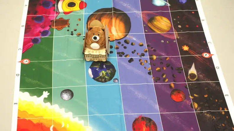 In the Mochi space kit, coding commands help Mochi explore the different planets in the galaxy.