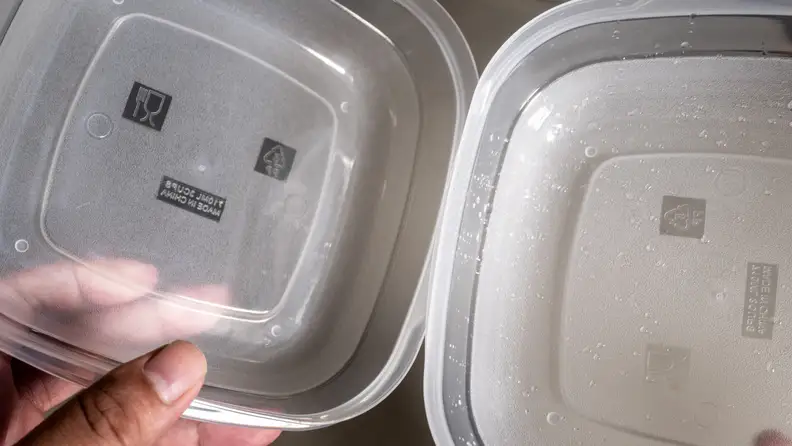 On the right, is a plastic container that underwent CrystalDry and the other a normal dishwasher cycle.