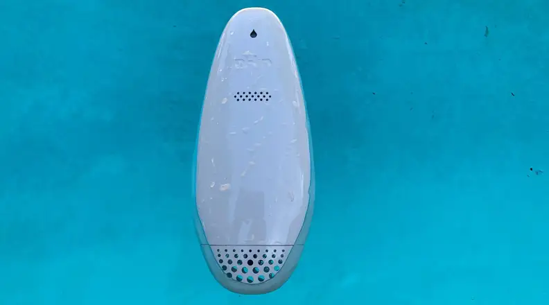 The pHin smart pool water monitor floats in a chlorinated pool.