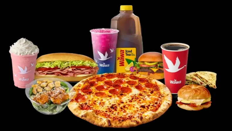 Assorted Wawa food and drinks, including a pizza, sandwiches, a burger, and iced tea
