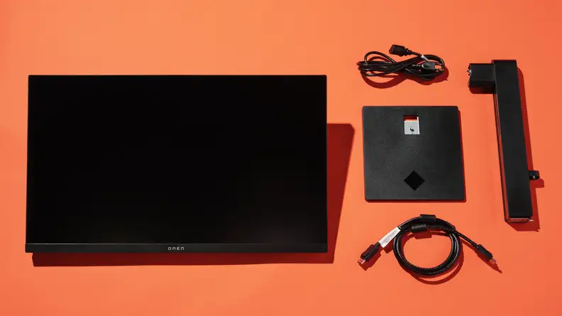 A monitor disassembled on an orange background