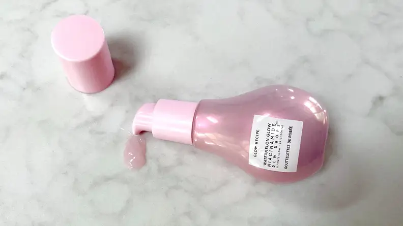 A shot of an open product bottle spilling the formula.