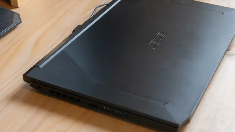 The laptop lies on a desk