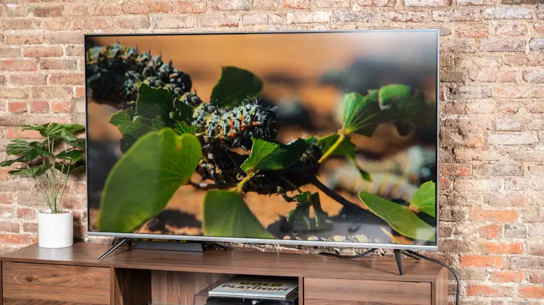 The Amazon Fire TV Omni displaying 4K/HDR content in a living room setting
