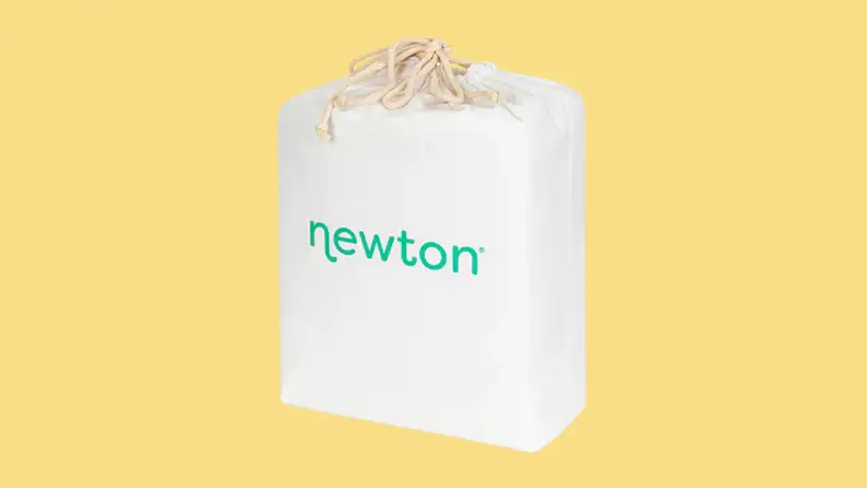 A Newton waterproof mattress pad, still in the packaging, on a yellow background.