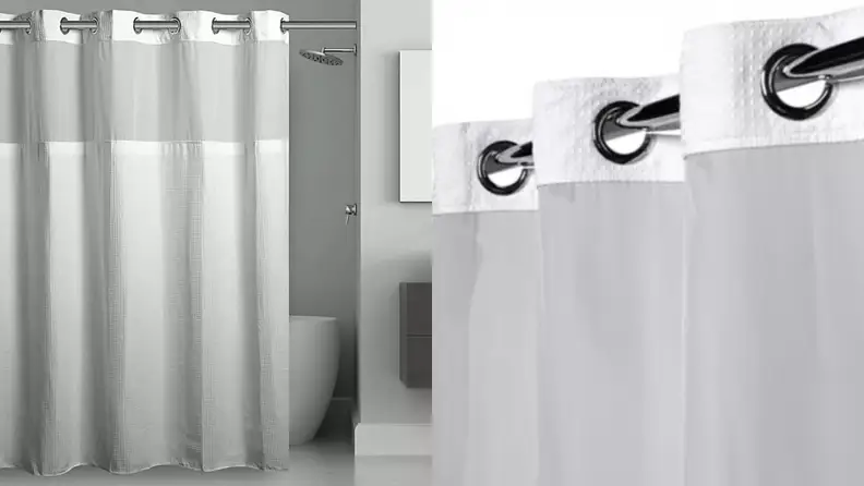 A gray and white shower curtain.