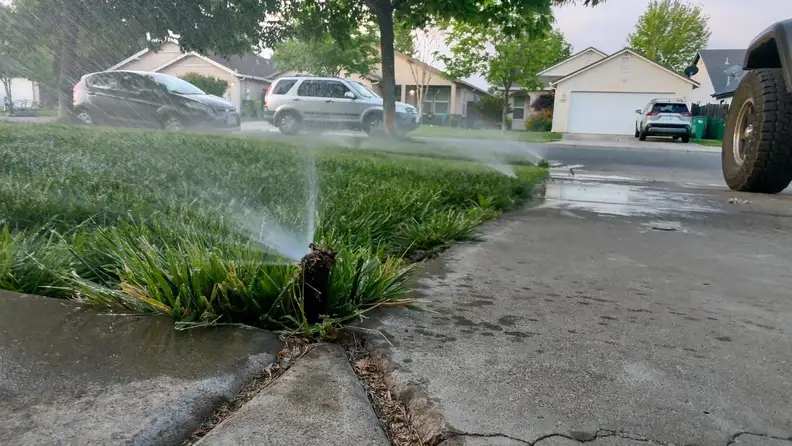 Close-up shot of the Wyze sprinkler in action watering the front yard.