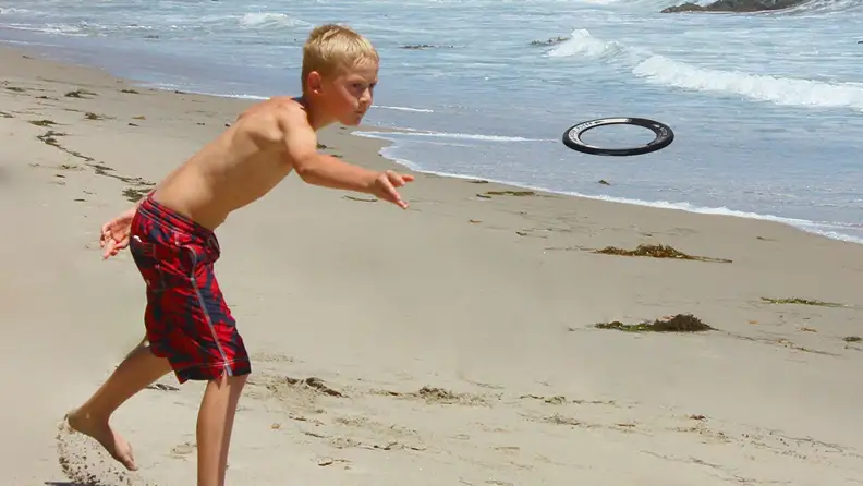 boy throwing disc