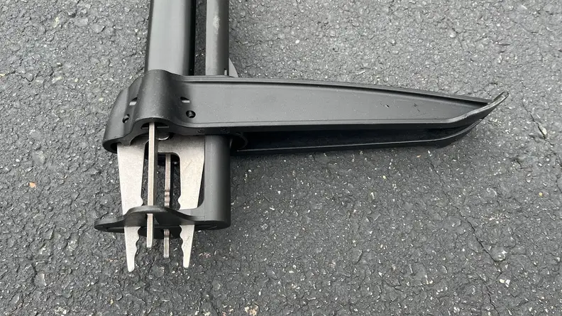 The four metal claws of the weeding tool.