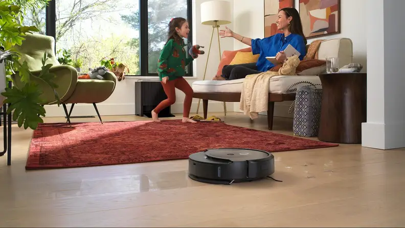 The iRobot Roomba Combo Max 10 cleaning a living room floor