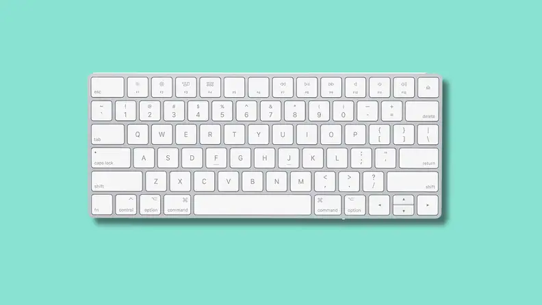 The Apple Magic Keyboard on a green background.
