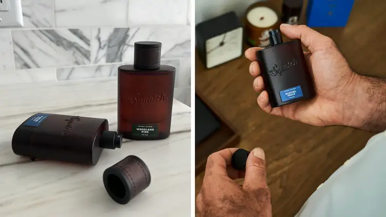 A set of hands holds a bottle of Dr. Squatch Glacial Falls. Also pictured are two bottles of cologne on a marble countertop.