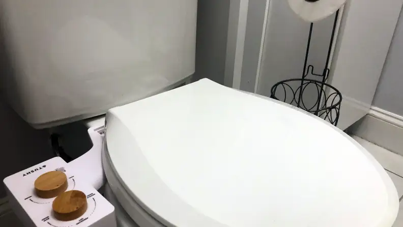 Tushy bidet on closed toilet seat