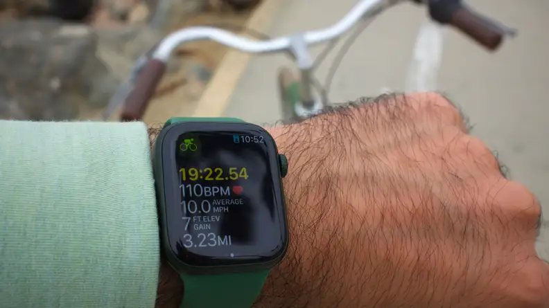 Person displaying Apple watch on wrist.