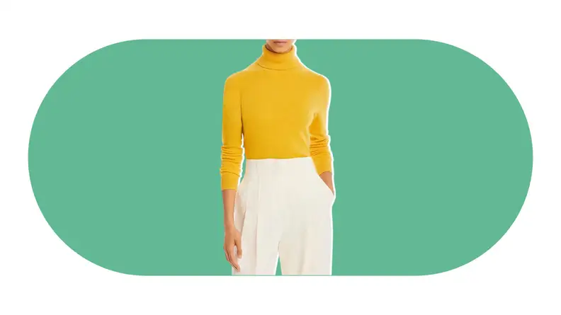 A model wearing a yellow cashmere turtleneck sweater.