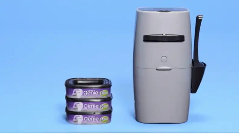A gray plastic Litter Genie bin