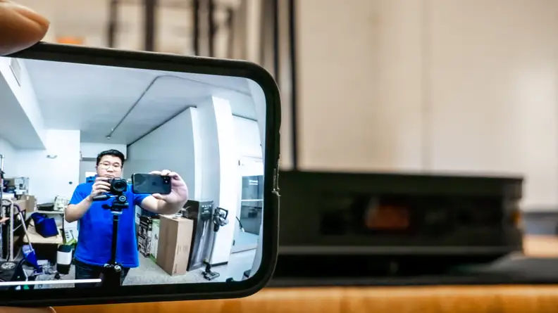 Man looking at a live stream of himself.