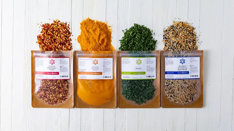 Four bags of spilled Savory Spice's side-by-side.