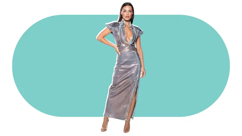 A model wearing a denim maxi dress that has a rose-gold metallic foil effect throughout.