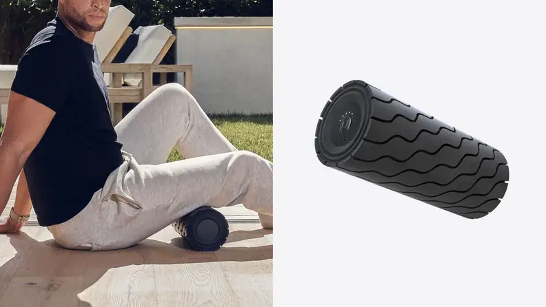 A man rolling his hamstring on the wave roller.
