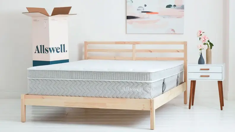 the allswell mattress on a brown wood bed frame