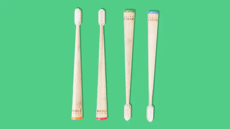 A Mable sustainable toothbrushes on green background.